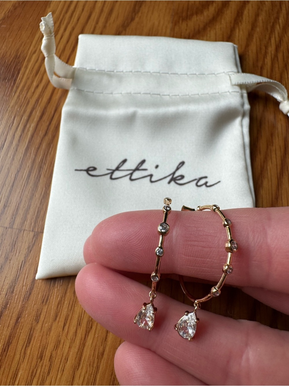 Ettika Gold Hoop Earrings with Teardrop Crystal Embellishments